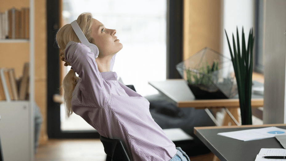 woman listening to music at work