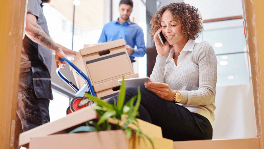 woman on phone while moving out