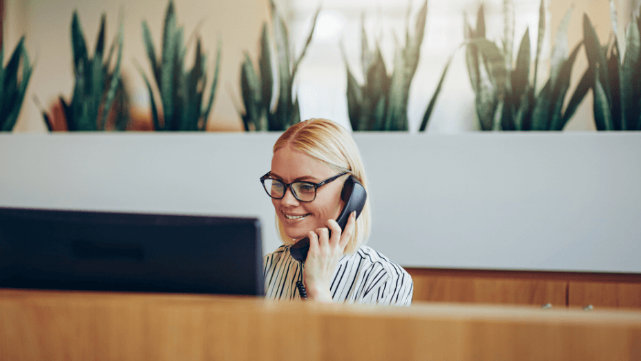 woman working on computer at her desk