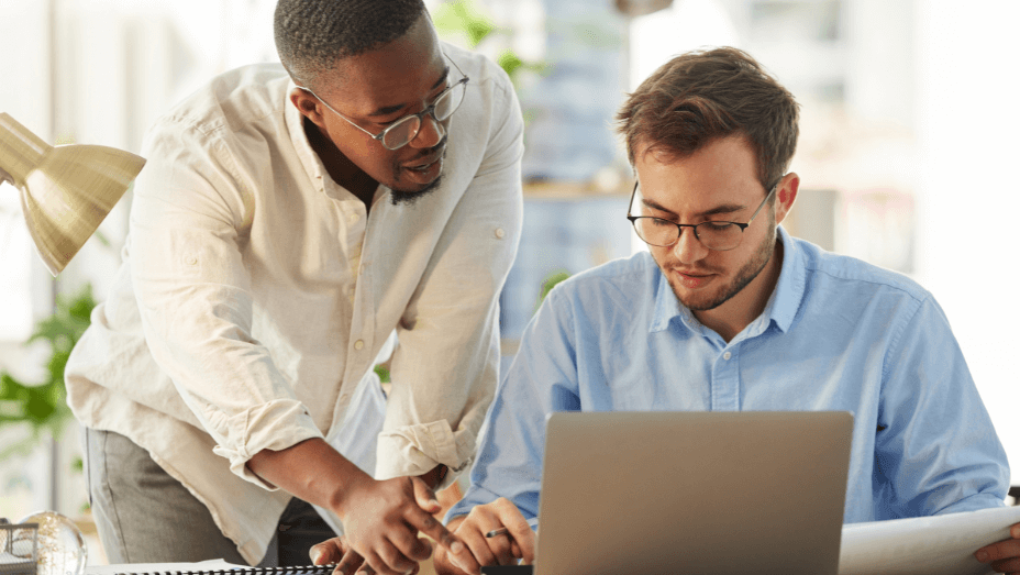 young male boss training a staff member