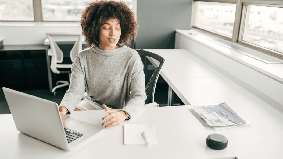 woman at work talking to a virtual assistant