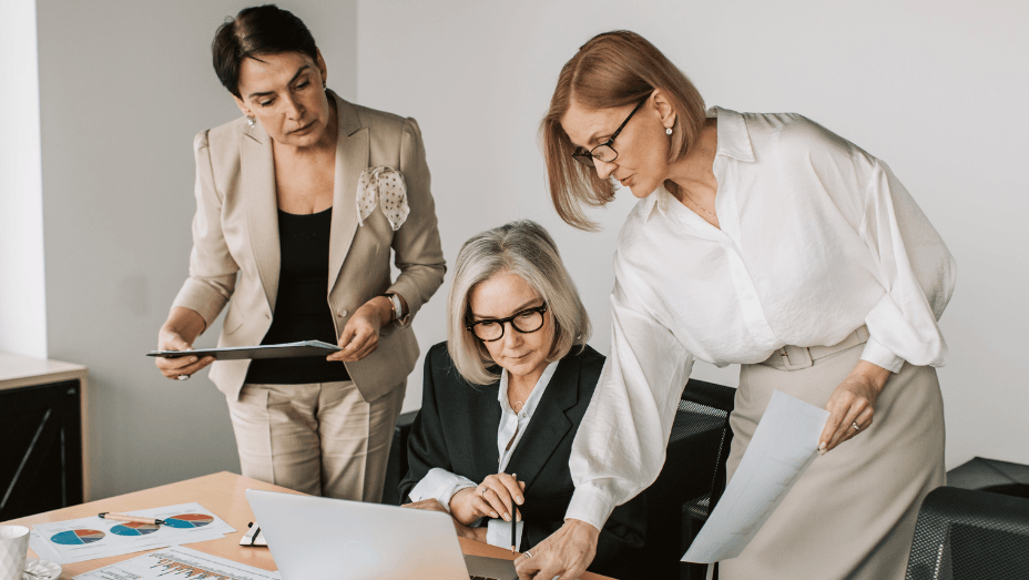 three women having a meeting