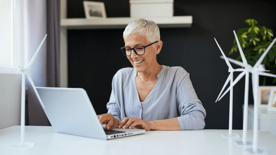 woman using laptop in a sustainable office