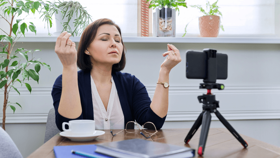 business mature woman meditating at home workplace