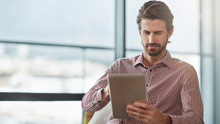 man working on digital device