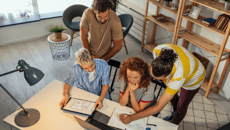 employees discussing office trends