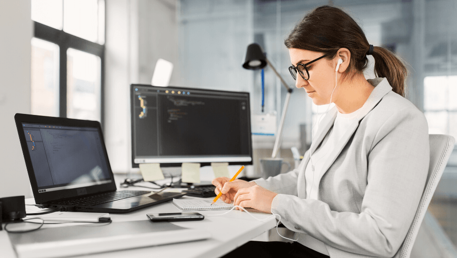 woman taking notes