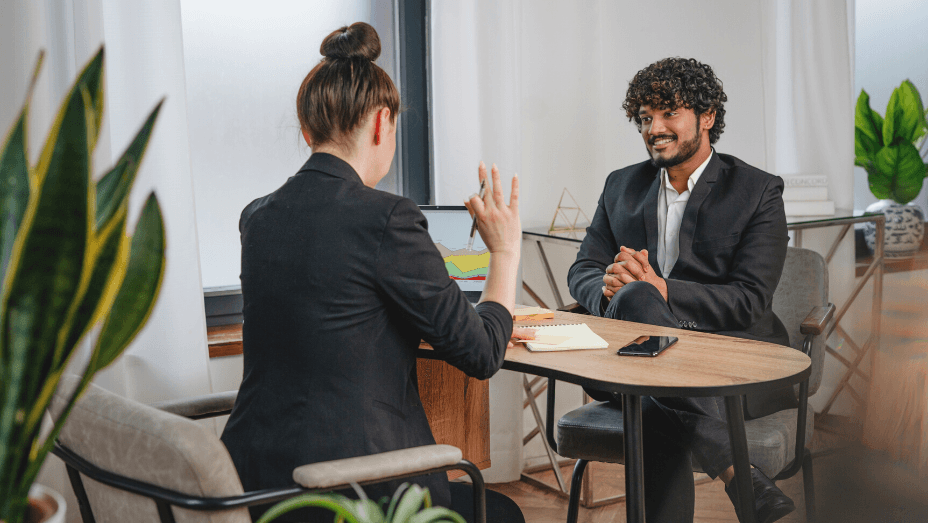 colleagues discussing a project in a green office