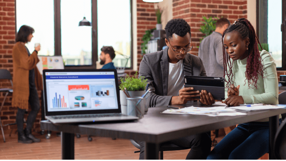 businessman-holding-tablet-computer-showing-compan-yng