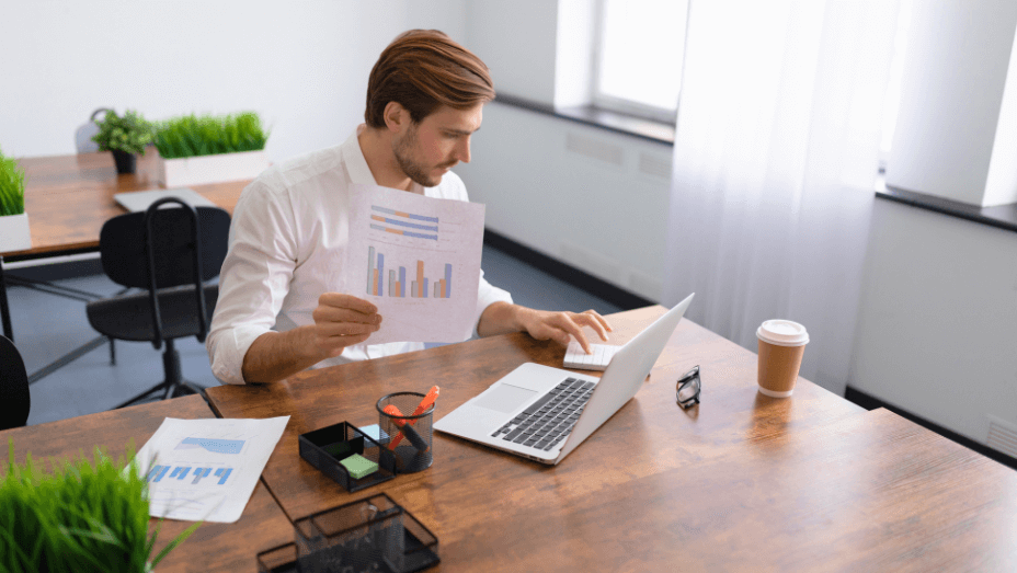 businessman-in-a-stylish-office-on-a-laptop-calculator