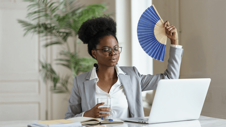 exhausted-businesswoman-tired-of-heat-waving-paper (1)