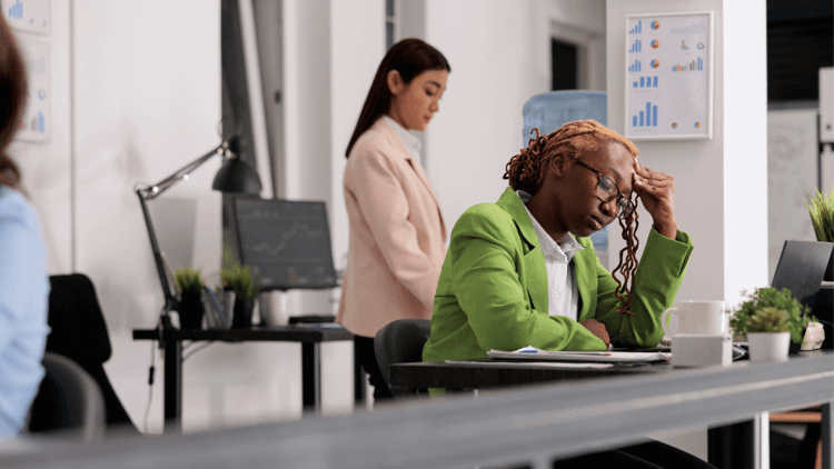female employee having headache, feeling down 