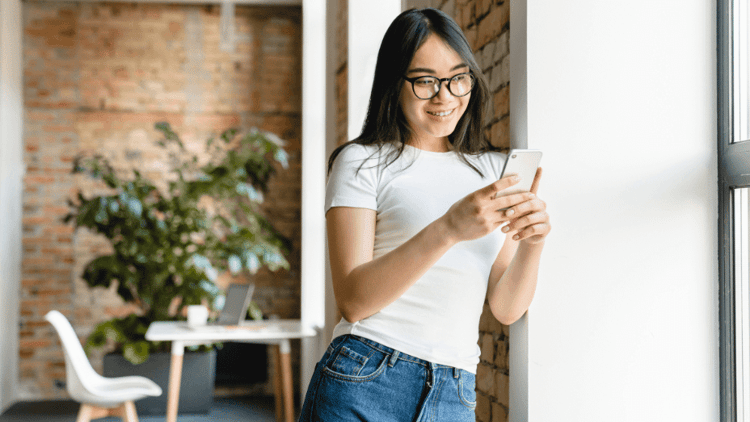 female employee using mobile booking app