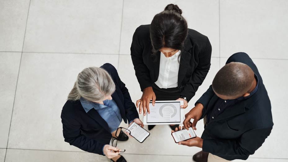 high angle of a group of businesspeople using digital products