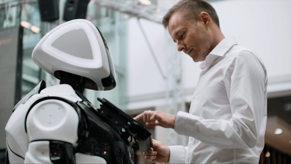male-employee-engaging-with-robotics-trends-technology-visitor-management-display