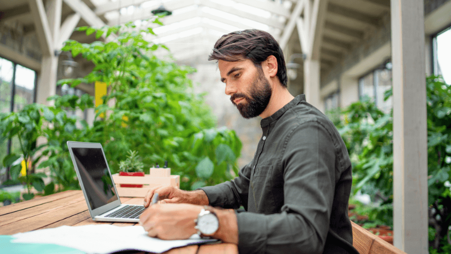 man working in a sustainable office space