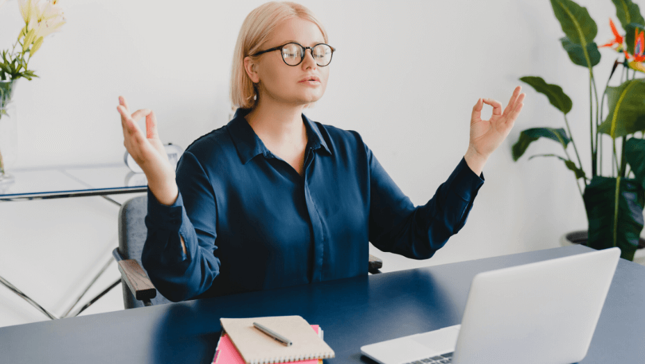 relaxed young businesswoman meditating