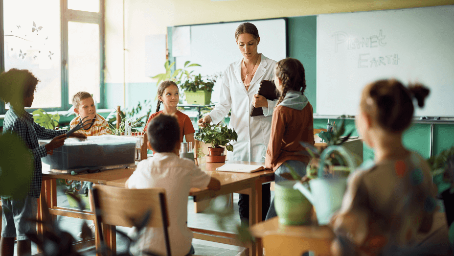 science-teacher-holding-botany-class-to-group-of-science