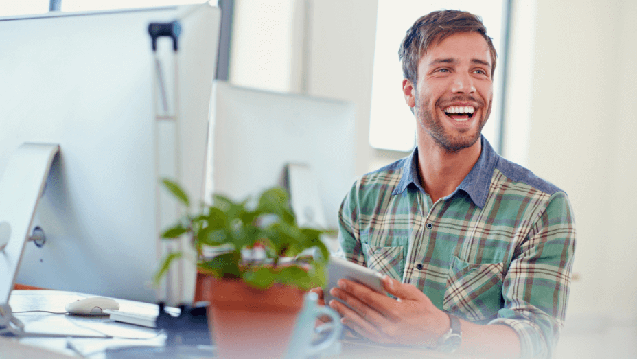 shot-of-a-satisfied-young-man-using-a-digital-tablet