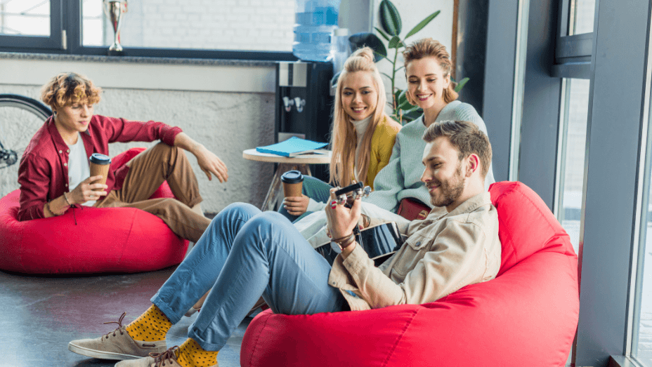 smiling-group-of-colleagues-sitting-on-bean-bag-chairc