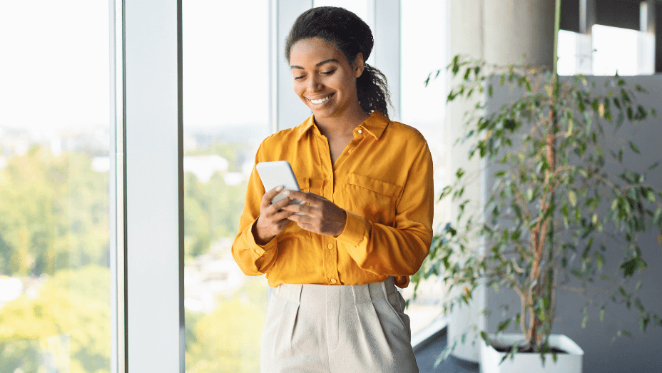 woman enjoying natural light in the office