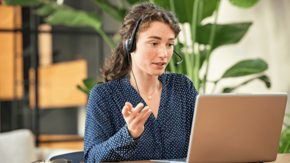 young-woman-on-video-call-using-laptop-at-office