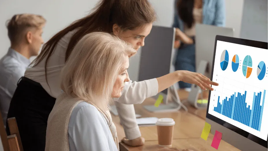 2 colleagues looking at a computer