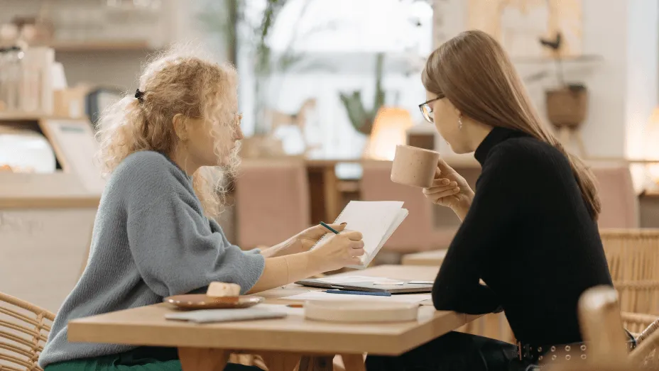 two women colleagues having conversation