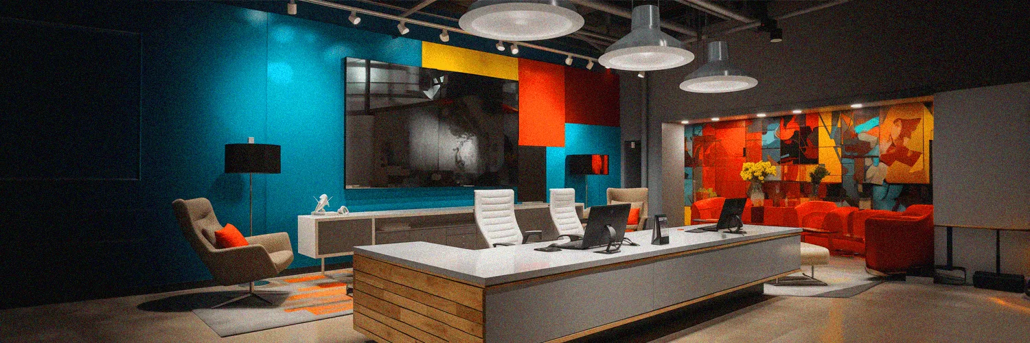 Security guard monitoring surveillance footage at front desk