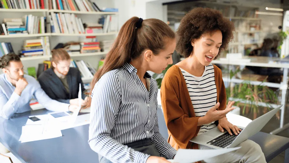 Colleagues collaborating in a modern workplace setting