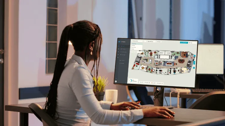 Employee looking at office map