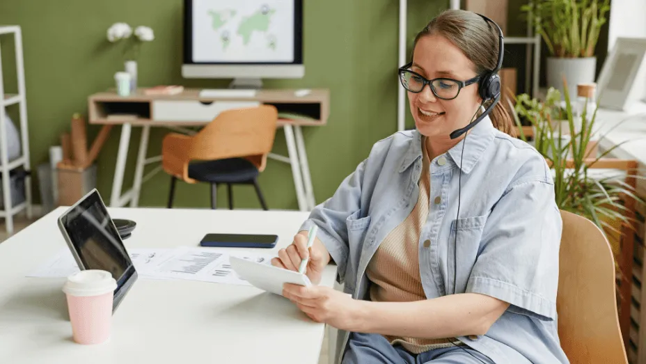HR specialist making notes during online call