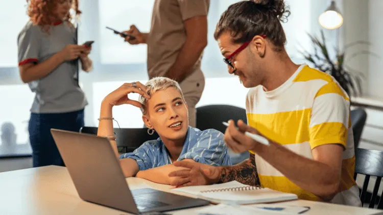 Colleagues using a workplace experience software