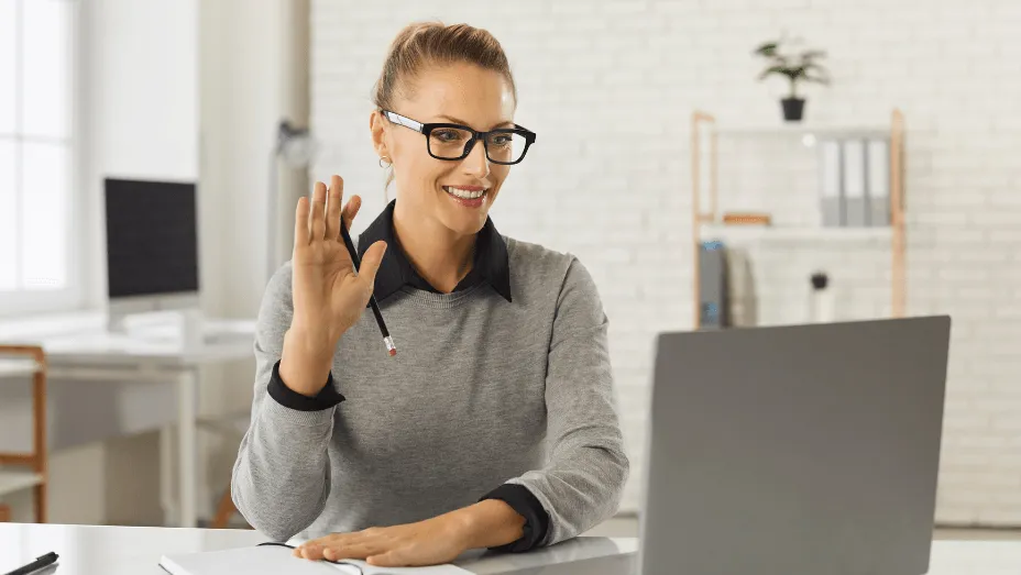 woman greeting her colleagues online
