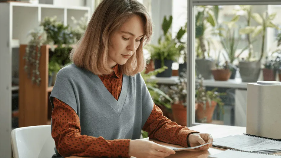 Woman working with documents in a green office