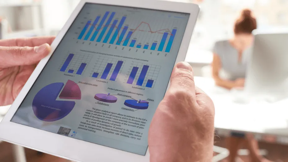 Man looking at statistics on iPad