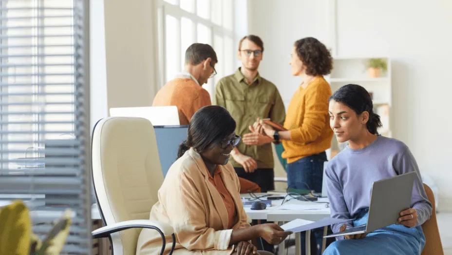 employees in the office having a meeting, colleague providing support