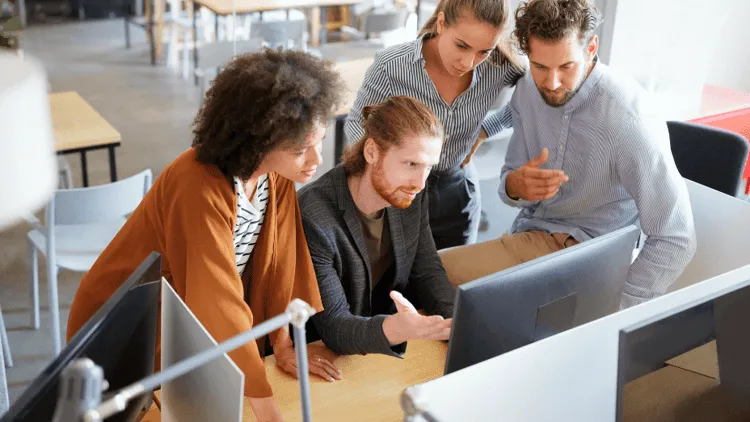 colleagues working with workplace technology