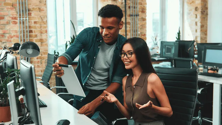 Colleagues using workplace technology