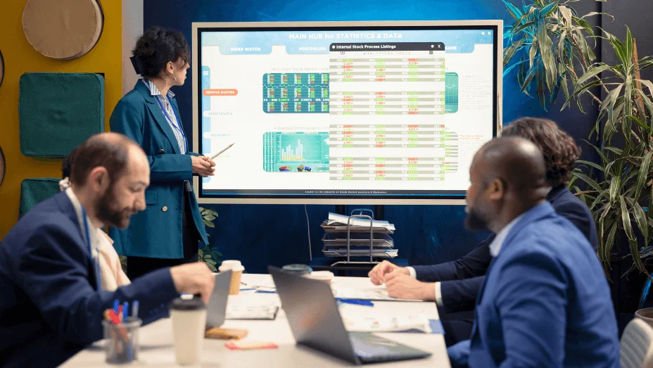 colleagues in a meeting room full of technology